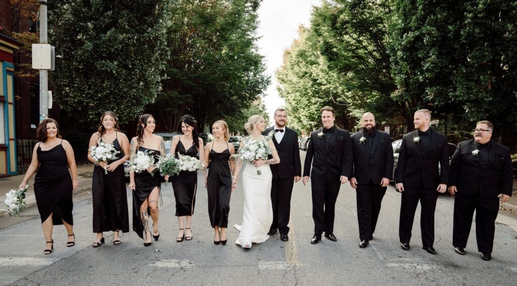 Wedding Party in Black Walking on Street