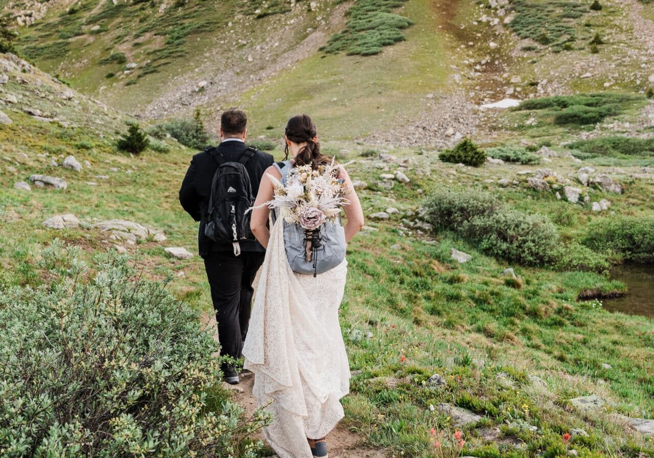 Bride and Groom Hiking in Colorado Mountains